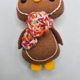 Brown plush gingerbread penguin body on a white background