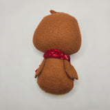 Gingerbread Penguin back with a red scarf on a light gray background