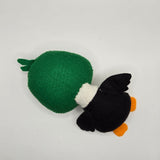 Handmade felt duck plush with a green head, white body, small white wings with black stitching, and bright orange beak and feet. The soft stuffed duck features large round eyes and a small tuft of felt feathers on top of its head.