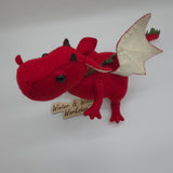 Handmade red felt dragon plush with white wings, small horns, and black button eyes. The soft stuffed dragon stands upright with a curved tail and stitched details.