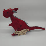Handmade red felt dragon plush with gray wings, small white horns, and black button eyes. The soft dragon has a stitched gray belly and stands upright with outstretched wings.