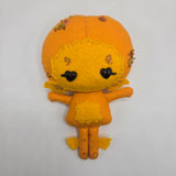 Orange Gillman that has orange features, sequins, and heart-shaped eyes, on a white background.