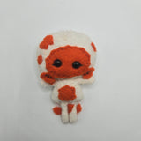 Small handsewn Gillman with orange and white pattern on a light gray background