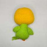 Handmade felt parakeet plush with a bright yellow head, green body, and patterned green wings. The cute bird has black button eyes, a small orange beak with a blue cere, and stitched feather details.