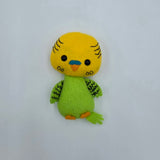 Handmade felt parakeet plush with a bright yellow head, green body, and patterned green wings. The cute bird has black button eyes, a small orange beak with a blue cere, and stitched feather details.