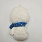 Winter-themed Penguin with a white back and a blue scarf on a light gray background