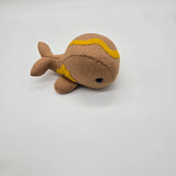 Handmade whale plush designed like a hot dog with mustard topping, soft brown food-themed whale stuffed animal on white background.